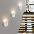 Sleek Black Round LED Wall Sconce for Indoor and Outdoor Use