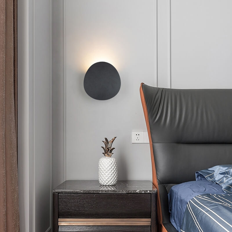 Sleek Black Round LED Wall Sconce for Indoor and Outdoor Use