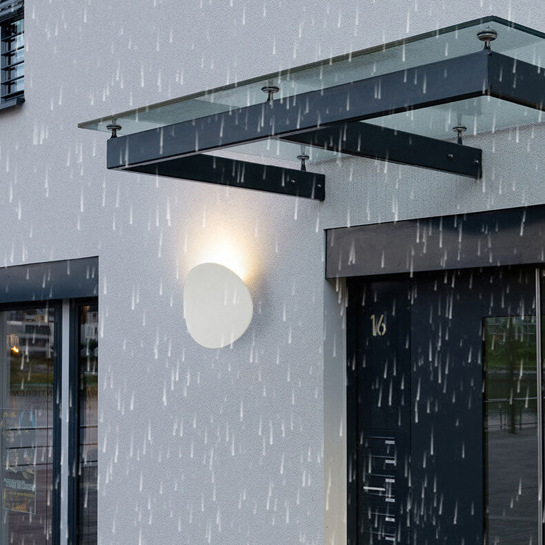 Sleek Black Round LED Wall Sconce for Indoor and Outdoor Use