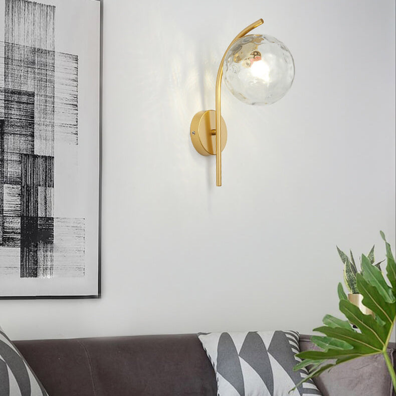 Nordic Arc Brass Glass Globe 1-Light Wall Sconce for Modern Interiors