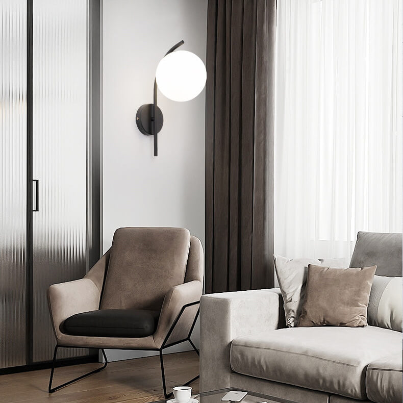 Nordic Arc Brass Glass Globe 1-Light Wall Sconce for Modern Interiors
