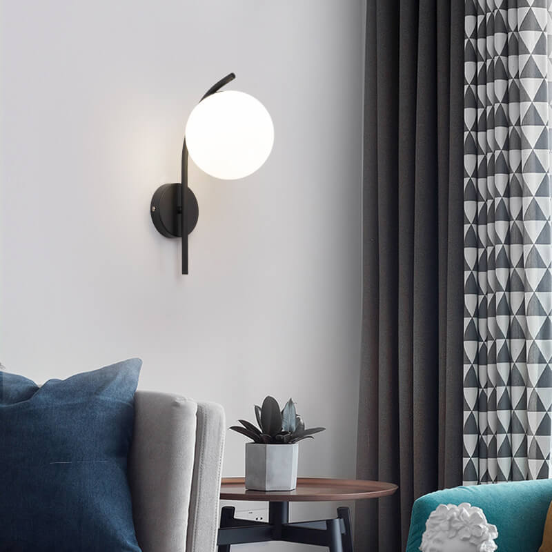 Nordic Arc Brass Glass Globe 1-Light Wall Sconce for Modern Interiors