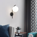 Nordic Arc Brass Glass Globe 1-Light Wall Sconce for Modern Interiors