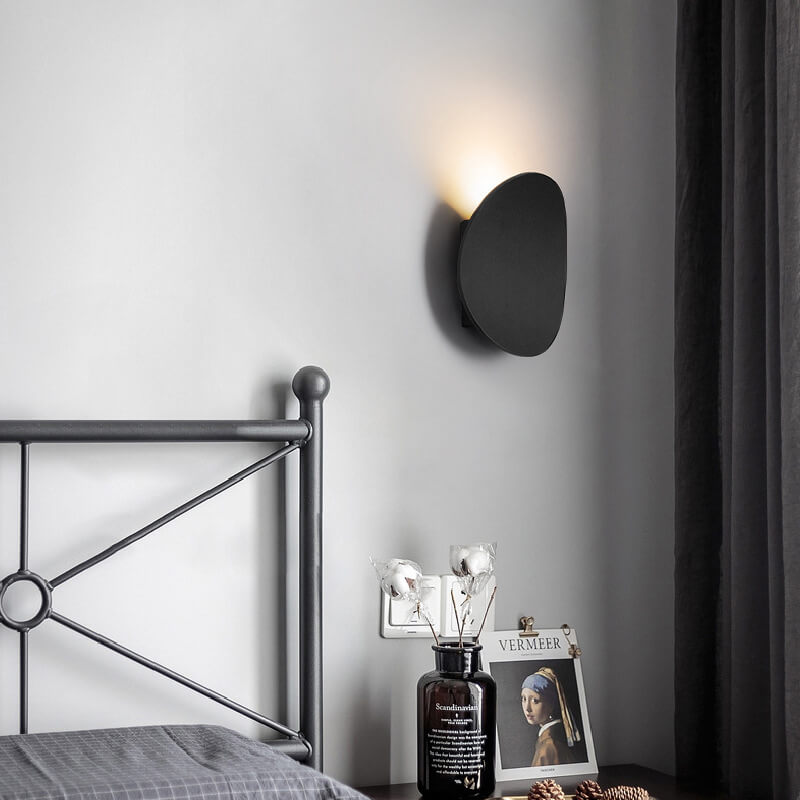 Sleek Black Round LED Wall Sconce for Indoor and Outdoor Use