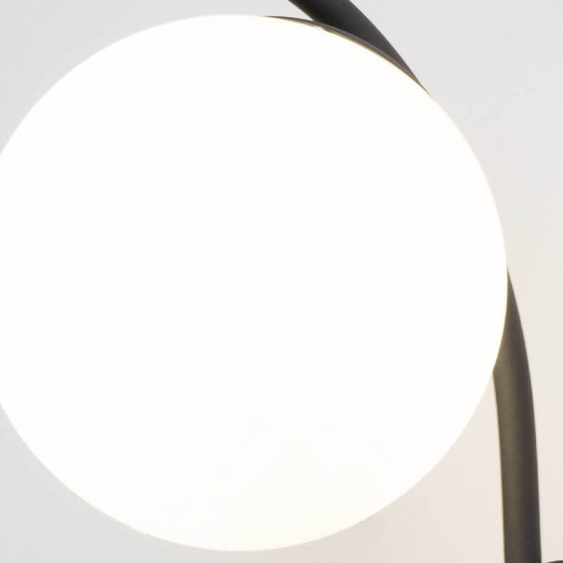 Nordic Arc Brass Glass Globe 1-Light Wall Sconce for Modern Interiors