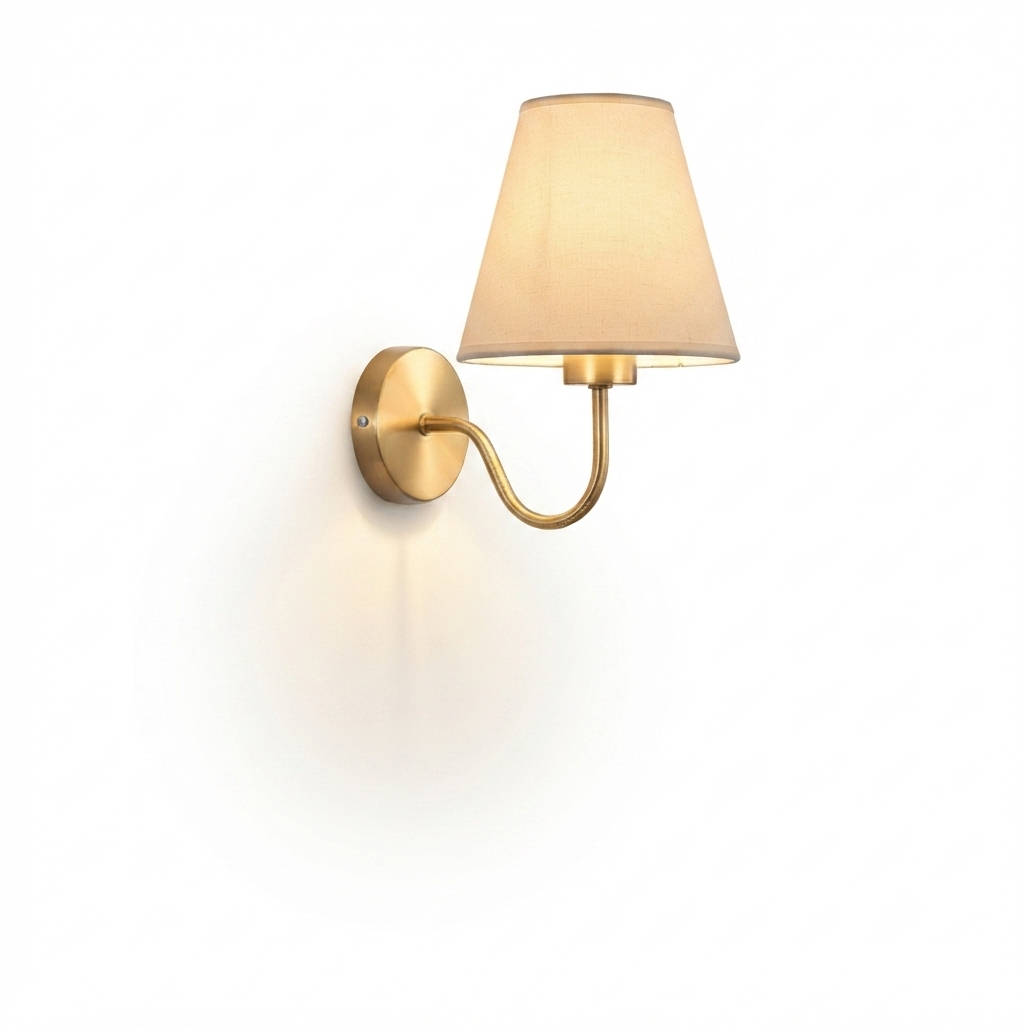 Modern wall sconce light fixture with a brushed brass finish and a tapered fabric shade, shown against a solid white background.