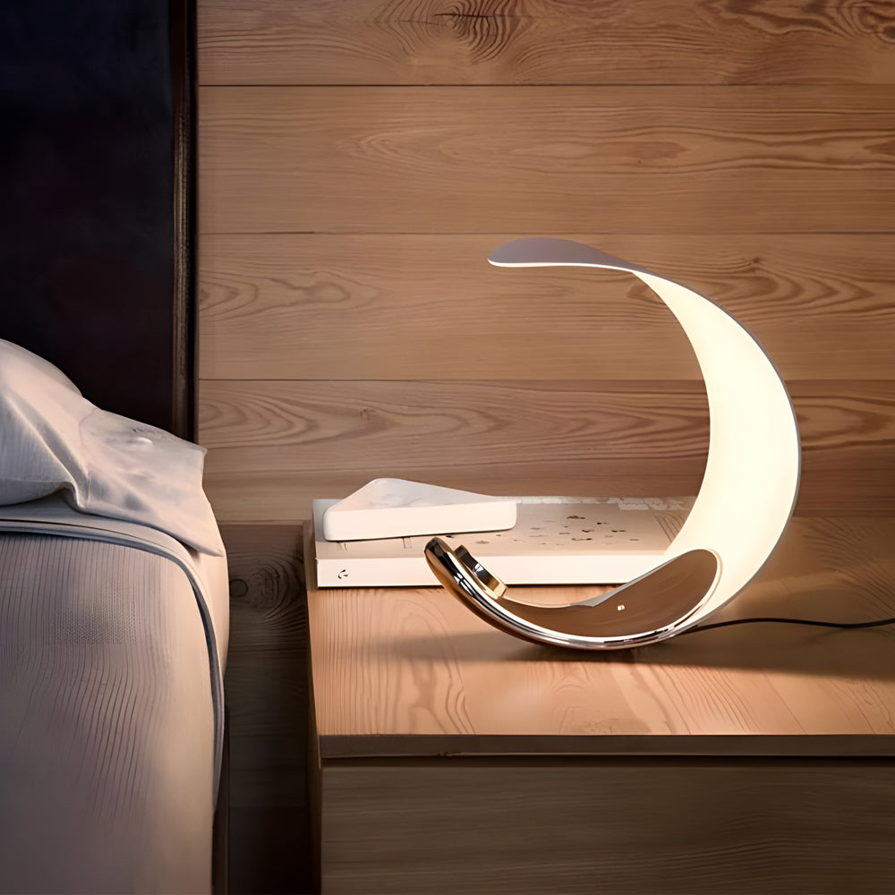Sleek Curved Silver Chrome LED Table Lamp for Modern Living Room Decor