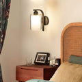 Sleek Black Cylindrical Glass Wall Sconce for Modern Living Spaces
