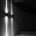 Sleek Black LED Up-Down Wall Sconce for Outdoor Building Illumination
